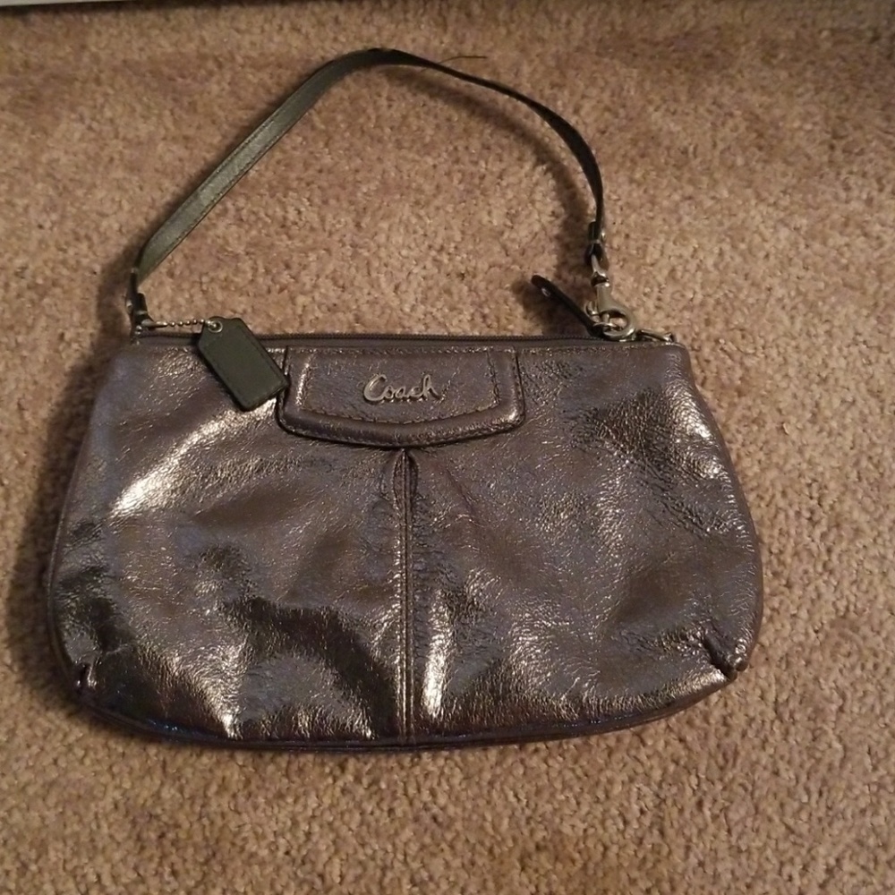 Metallic silver coach clutch